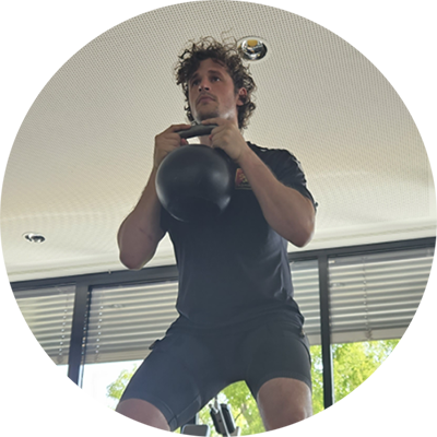 Physiotherapist Roberto Baumgartner from Flyeralarm FC using Fit Cuffs V3.1 leg cuffs for recovery and muscle rehabilitation. Baumgartner demonstrates the advanced blood flow restriction (BFR) therapy technology, showcasing its application for enhancing athletic performance and faster recovery in professional sports